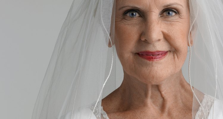 Senior woman wearing wedding dress, portrait