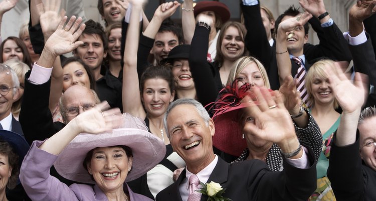 Wedding crowd waving and smiling, close-up