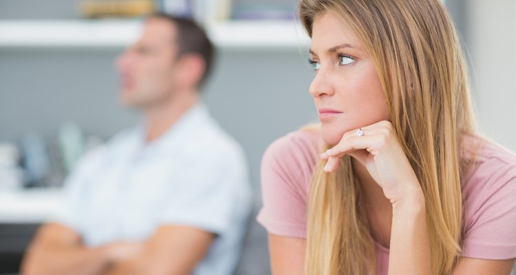 Couple not talking after a dispute on the couch