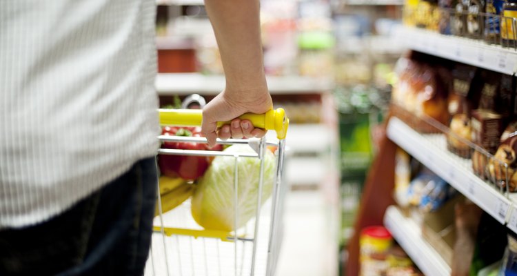 Man pushing shopping trolley