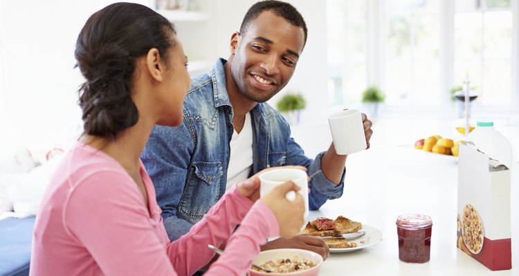Couple talking at breakfast table
