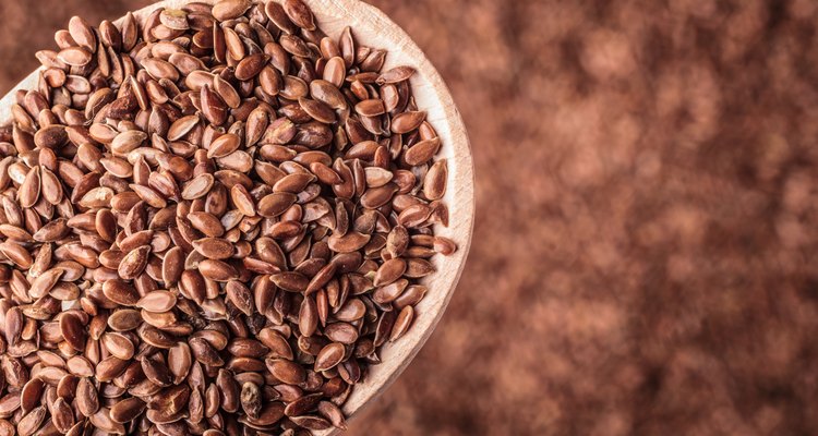 Flax seeds linseed on wooden spoon