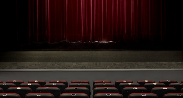 A musical director guides vocalists and instrumentalists with their parts in a musical.