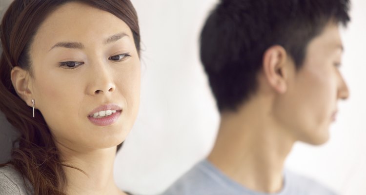 Close-Up of a Couple Sadly Looking Away From Each Other, Focus on Foreground