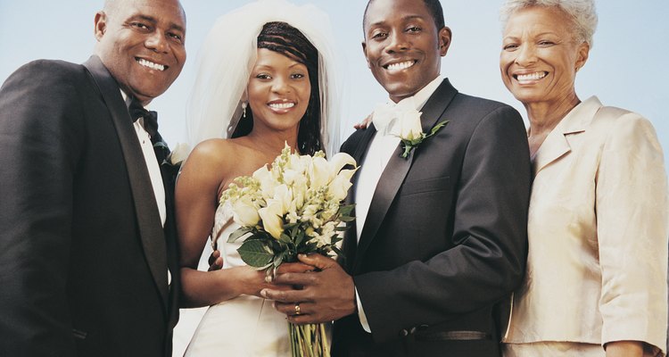 Wedding Portrait of a Bride and Groom Taken Outdoors With With Parents