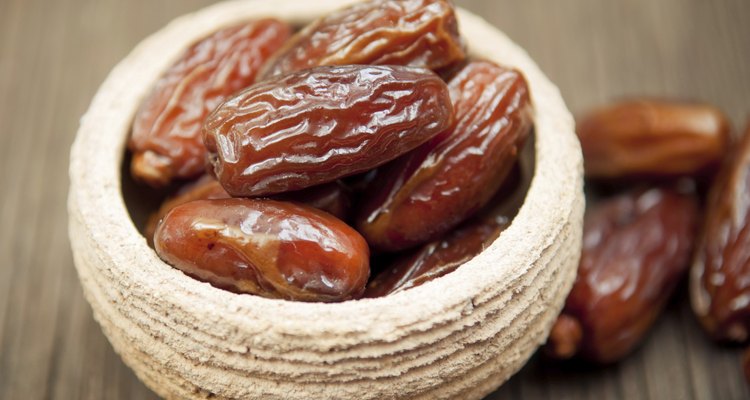 Delicious dates in small bowl