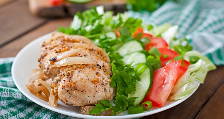 Baked chicken breast and fresh vegetables