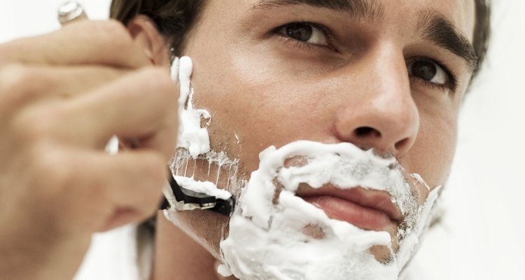 close-up of man shaving