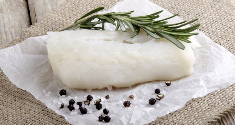 cod with rosemary on kitchen paper