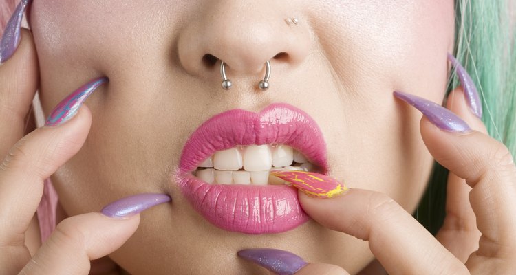 Close-up of a woman's mouth and fingers