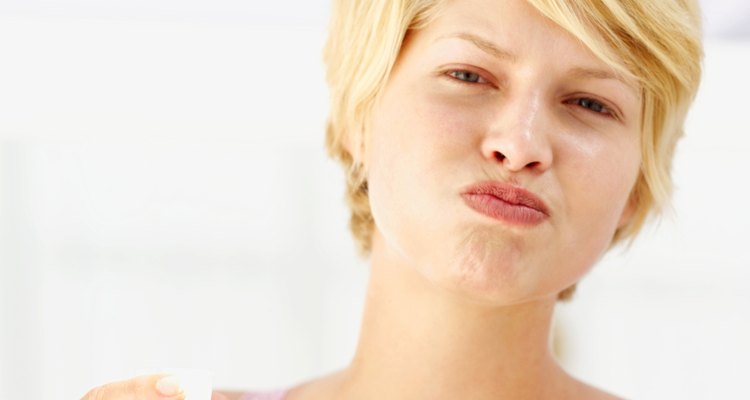 close-up of a woman rinsing her mouth with mouthwash