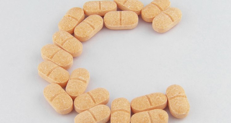 Vitamin C pills on white background