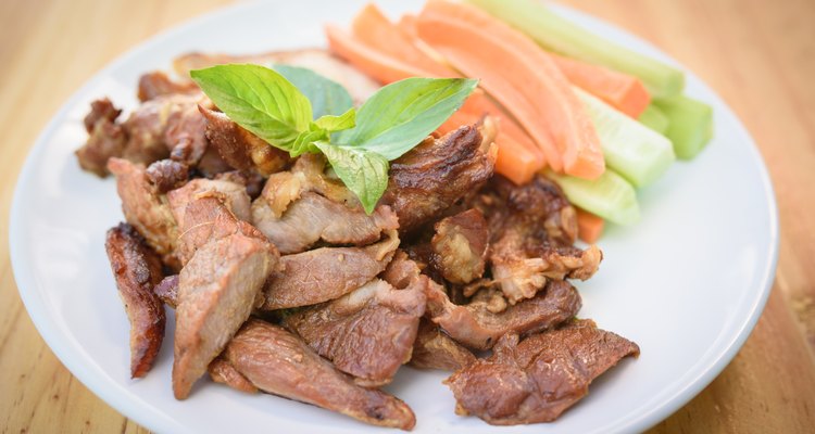 Delicious smoked pork with basil and vegetable