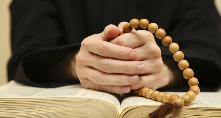 Priest reading from the holy bible, close up