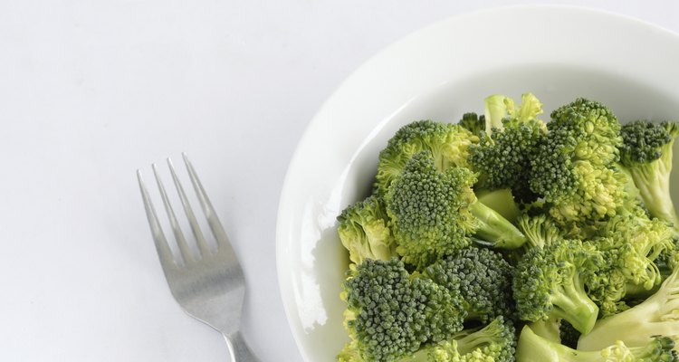 Broccoli in dish isolated on white