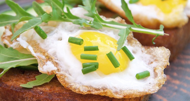 toast with fried egg, cucumber and arugula
