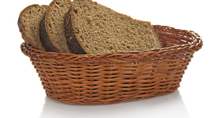 Fresh whole grain bread cuting on slices