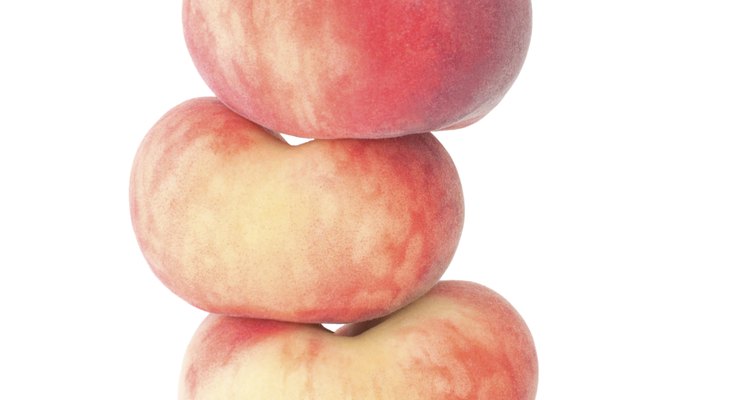 The doughnut peach is flatter than a regular peach.