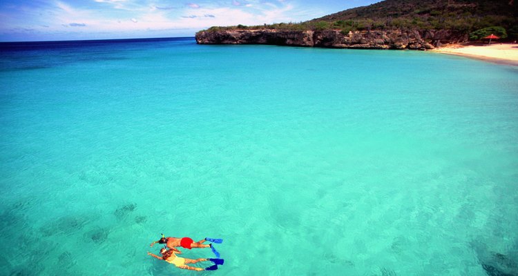 Couple snorkeling in crystal clear water off Knip Beach in Curacao