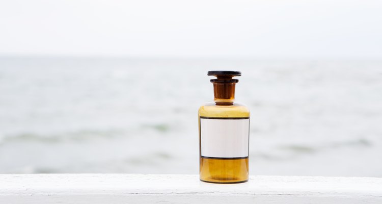 Vintage medicine bottle on sea background