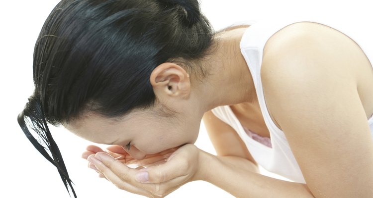 Woman washing her face