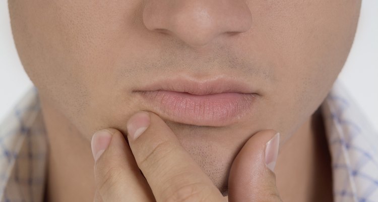 Person's hand on chin