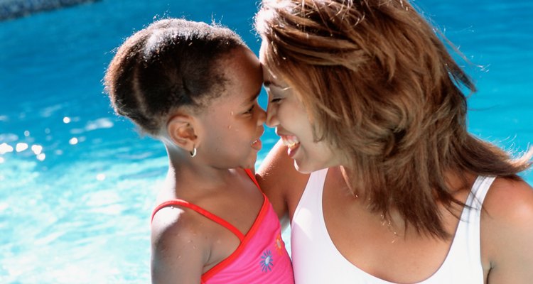 Mother and daughter by pool