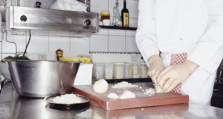 Chef preparing ingredients for meal, mid section