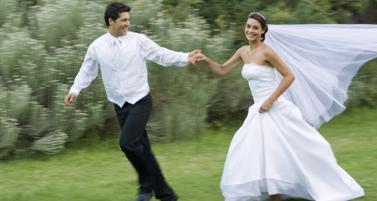 Bride and groom running