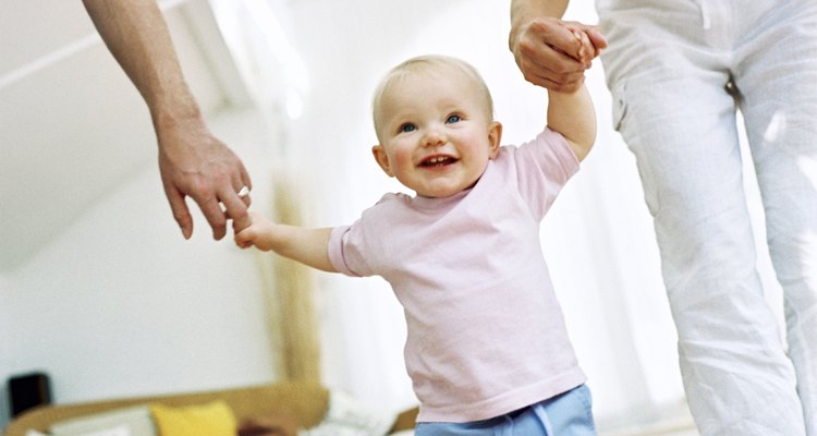 Toddler being held up