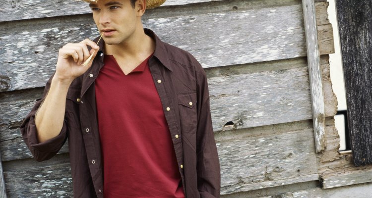 Portrait of a young man wearing a cowboy hat