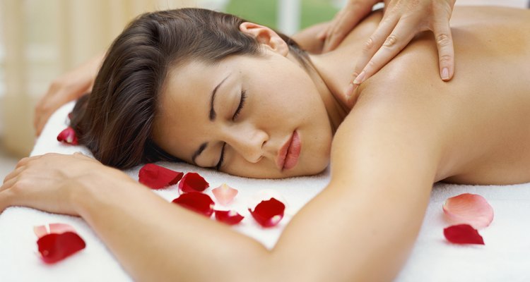 Close-up of a young woman getting a back massage