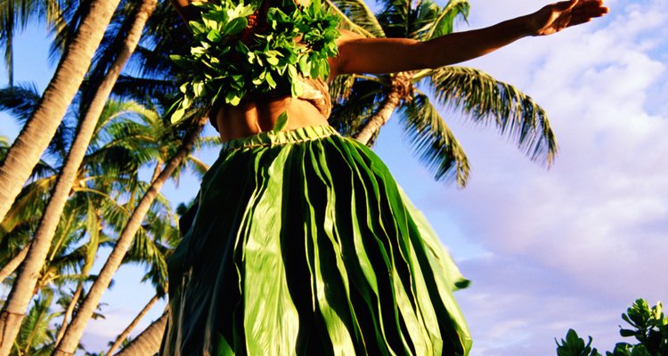 Hula dancer near palm trees, Hawaii