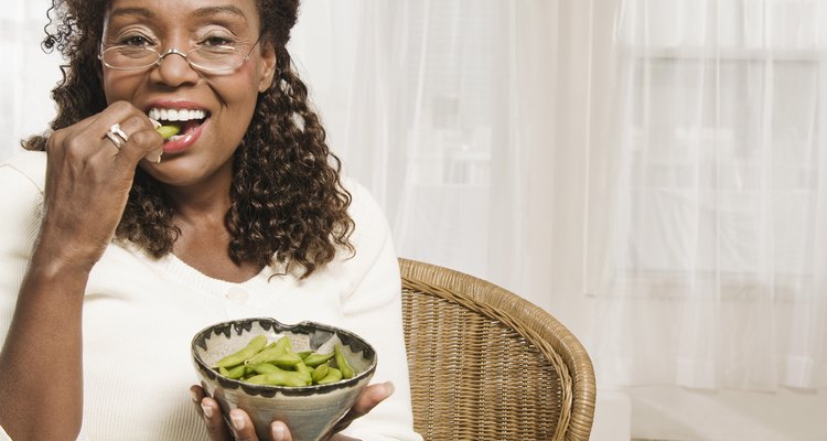 Woman eating edamame