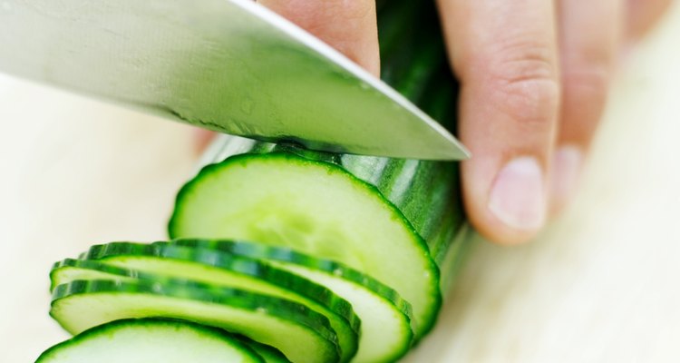 close-up of a cucumber being sliced