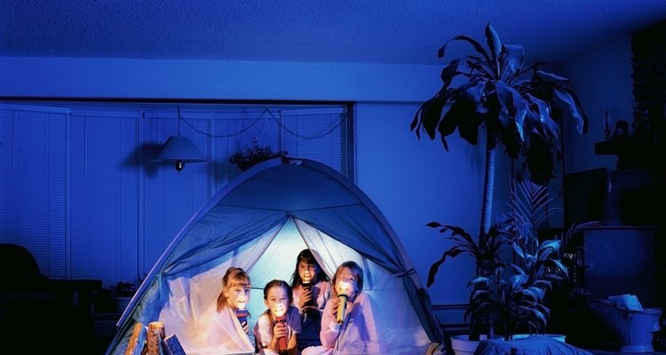 Set up a tent and hold the sleepover outdoors.