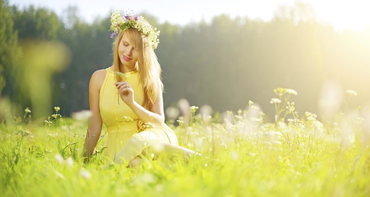 smiling girl relaxing on green meadow