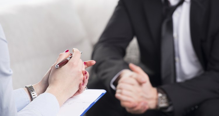 psychiatrist examining a male patient