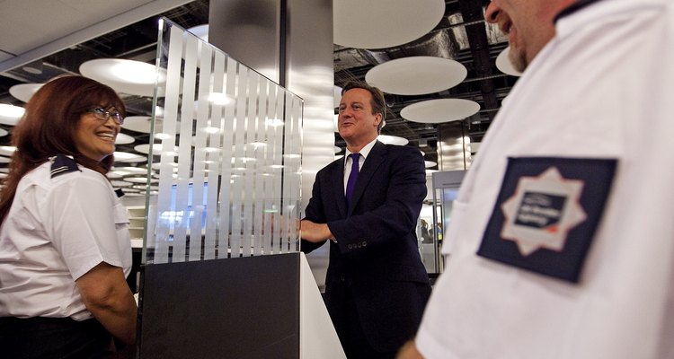 Prime Minister David Cameron with UK border agency officials