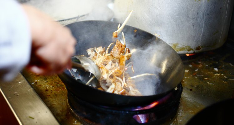 Preparing food in restaurant kitchen