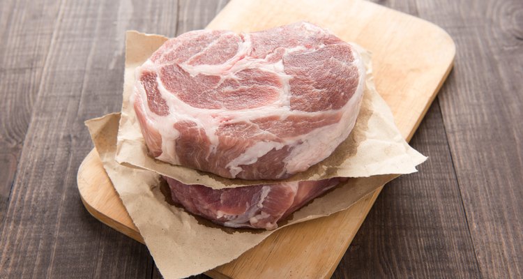 Raw fresh meat steak on wooden background
