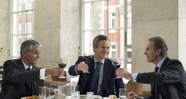 Business colleagues toasting in restaurant