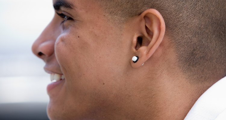 Profile of smiling man with earring