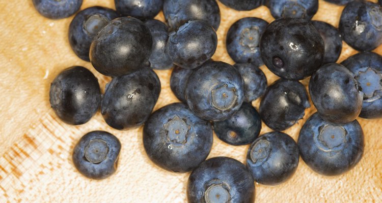 Blueberries on wood cutting-board