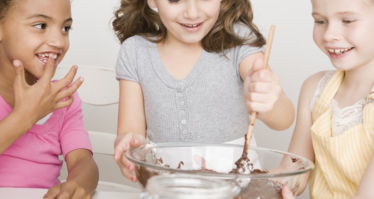 Multi-ethnic girls making batter