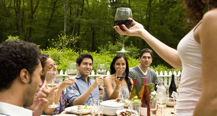  Hispanics at outdoor garden party at country home