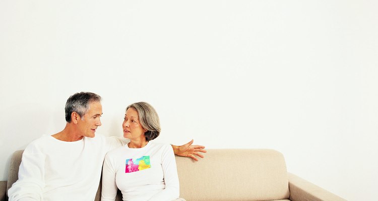 Mature Couple Talking on a Sofa