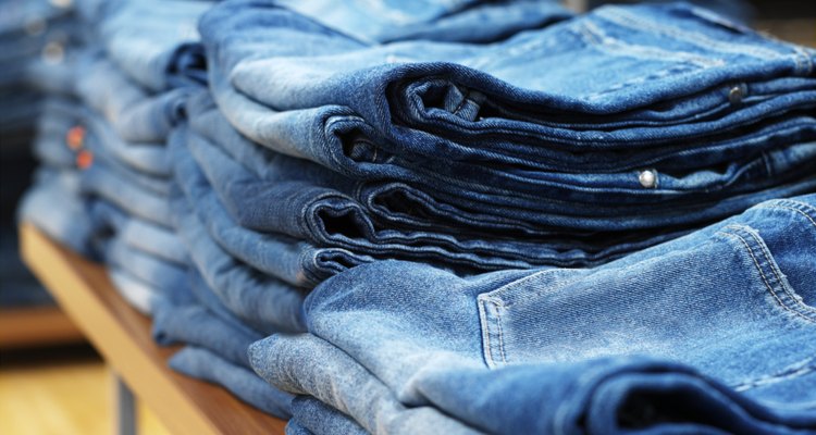 jeans on shelves in a clothing store