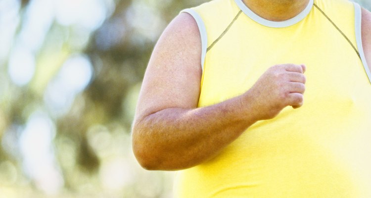 mid adult man jogging in a park