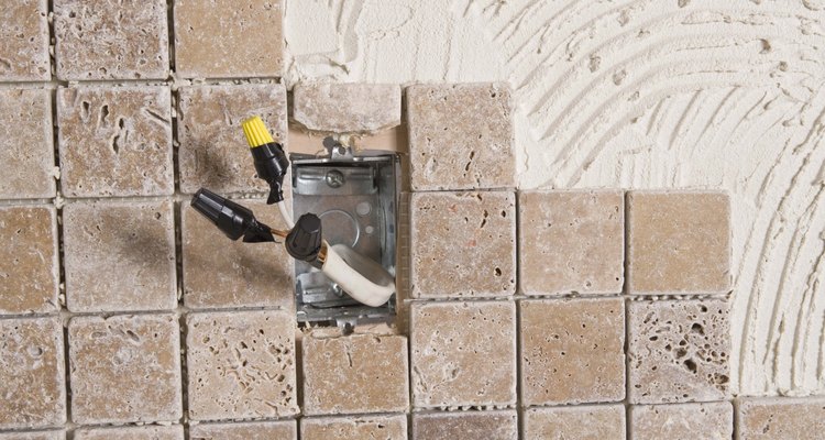 The capped off outlet show here was done so that tile and grout could be installed without the energised outlet in the way.